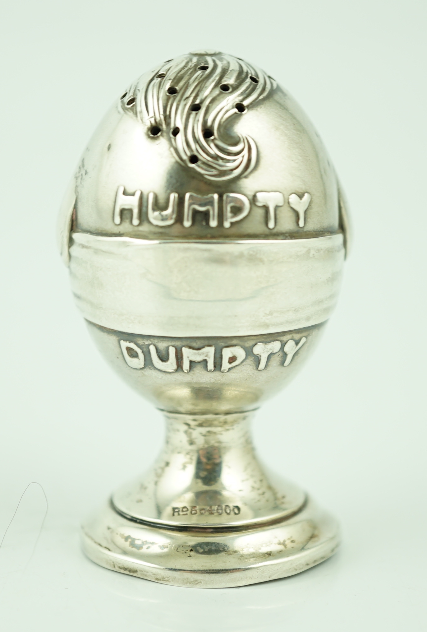 A George V novelty silver pepperette, modelled as Humpty Dumpty, by Levy & Salaman